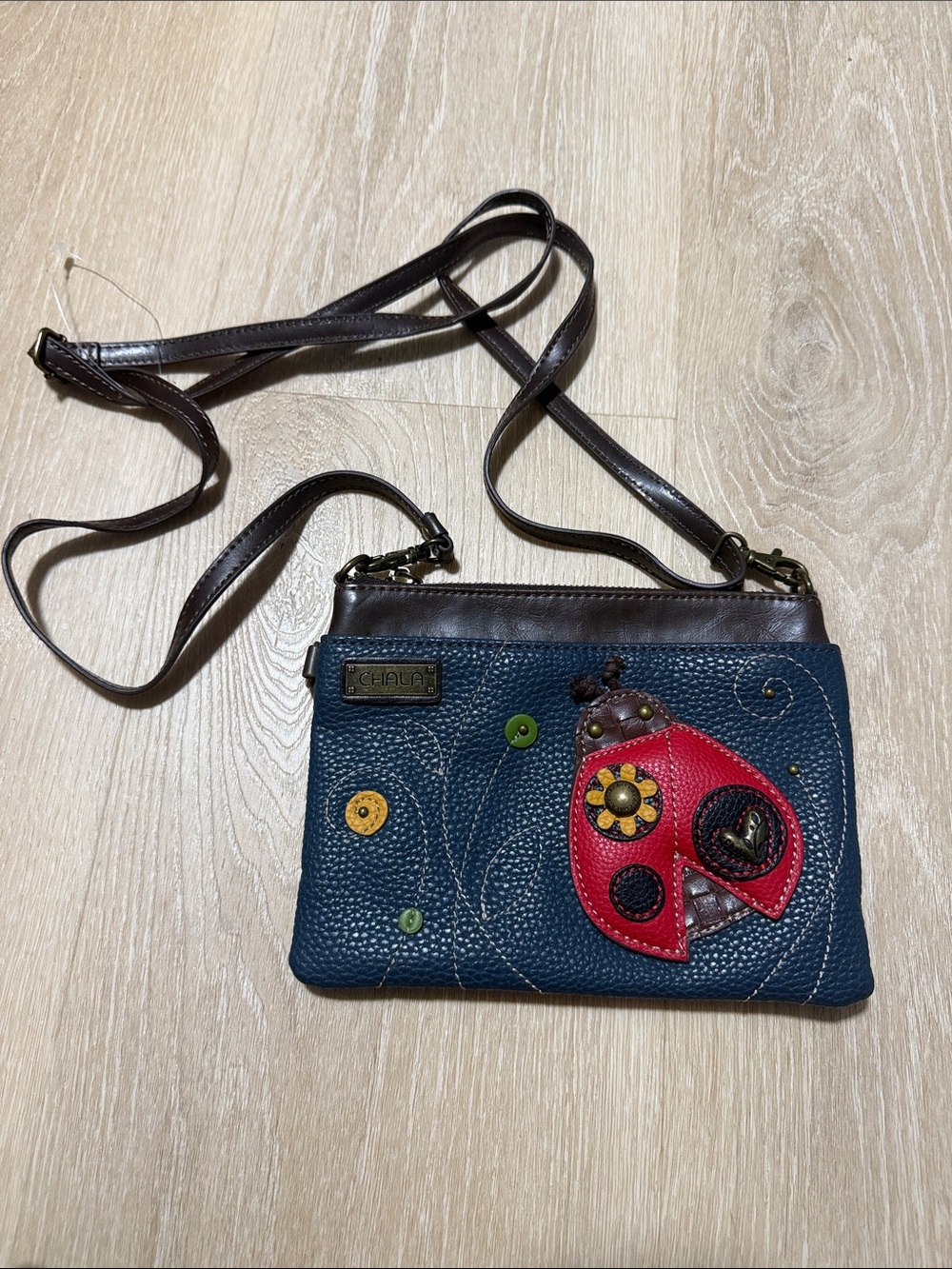 Chala Navy and Brown Crossbody with Red Ladybug Applique